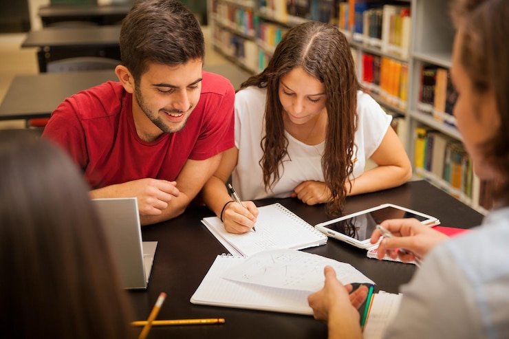 group-young-adults-studying-together-having-good-time-school-library_662251-1224